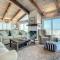 Beachfront Deck with steps down to the white sandy beach Sea Dunes Sandcastle 1A