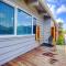 Beachfront Deck with steps down to the white sandy beach Sea Dunes Sandcastle 1A