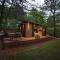 Glamping cottage with glass front and hot tub!