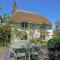 Putsborough Manor 3 Self Catering Cottages with Beach a short walk, dog friendly all year, On site Tennis, Play Area, Paddock, Spa baths, BBQ, Private Gardens, Superfast WIFI