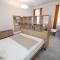 ALURE RESIDENCES 10 - 24h self check-in & private parking next to the apartment building included, CITY CENTER right on SNP Square in a quiet passage, new building, best deal in town - Banská Bystrica