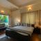 StayVista at The Woods with Indoor Fireplace & BBQ