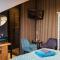 Koraal - Comfortabele kamer bij B&B Gezond aan Zee - Toegang Wellnesstuin meerprijs