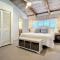 Beachfront Deck with steps down to the white sandy beach Sea Dunes Sandcastle 1A
