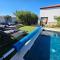 Villa Izziy by the beach with a sea view and heated pool - Ražanac