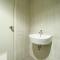 Elegant and Restful 1BR at 35th Floor Vasanta Innopark Apartment By Travelio