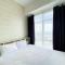 Elegant and Restful 1BR at 35th Floor Vasanta Innopark Apartment By Travelio