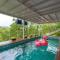 The Glasscape by StayVista - Hillside getaway with Pool and Indoor games
