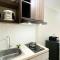 Modern Look and Tidy Studio Gateway Park LRT City Jatibening Apartment By Travelio