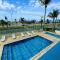 Apartamento de frente para a praia com piscina - 卡拉瓜塔图巴