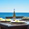 Stunning Waterfront Views Beach steps away