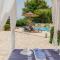 SUNRISE BEACH VILLA, - garden gate opens onto the beach - Potámion