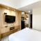 Cozy and Homey Studio Room Pollux Chadstone Apartment By Travelio