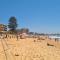 Beachfront Sunset View Apartment - The Coachhouse