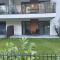 Plażowa Park Apartment with Garden by Noclegi Renters