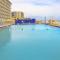 Tropical 1BD vacation condo in beautiful resort setting with pool amenities to enjoy - شاطئ أورموند