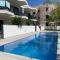 Air-conditioned Elisa Apartment with spacious sunroof lounge and swimming pool