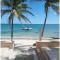 Escape to Serenity by the Sea! Beachfront Apartment with Pool, Just 5 Minutes from the Ferry - Cancún