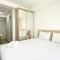 Homey and Compact Studio at Azalea Suites Apartment By Travelio - 芝卡朗