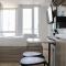 Homey Designed and Tidy Studio Tokyo Riverside PIK 2 Apartment By Travelio - Rawalembang