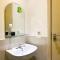 Comfortable 2BR at 25th Floor Meikarta Apartment By Travelio