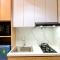 Homey and Minimalist 1BR Vasanta Innopark Apartment By Travelio
