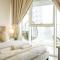 Elegant 1BR Retreat with Rooftop Pool in JVC - Dubaj