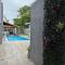 Casa Mar Itanhaem temporada Piscina - 伊塔尼亚恩