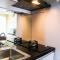 Cozy and Elegant 1BR Apartment Belmont Residence Puri By Travelio