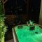 Suite Tino - Jacuzzi privé, cabine infrarouge & vue