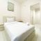 Minimalist and Homey Studio Room at Amartha View Apartment By Travelio