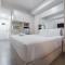 Warm and Cozy Style Studio Room at Paltrow City Apartment By Travelio