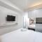 Warm and Cozy Style Studio Room at Paltrow City Apartment By Travelio