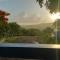 Rooster Run Glamping Camping has rooftop and off the ground Glamping experience for 1 to 16 in a single tent and views of The Rain Forrest and to Culebra across the Atlantic Ocean w Tents, Linens, Deluxe Air Beds, Warm Shower and More at a Great Price - Vieques