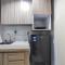 Comfort 1BR at Amartha View Apartment By Travelio - Semarang