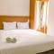 Simply and Cozy Pool View 2BR at Great Western Apartment By Travelio