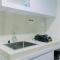 Elegant 1BR without Living Room at Bintaro Embarcadero Suites Apartment By Travelio - Tangerang