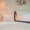 Cozy Studio at Patraland Amarta Apartment By Travelio