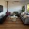 Waterfront home with outdoor spa bath and mountain views - 5 min drive to city