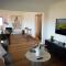 Waterfront home with outdoor spa bath and mountain views - 5 min drive to city