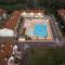 Poolside getaway seaside flat in Rosolina
