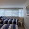 Beachfront Sunset View Apartment - The Coachhouse