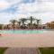 Gated townhouse with 2 suites, heated pool, hot tub