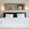 Minimalist Studio The Oasis Apartment near Omni Hospital Cikarang By Travelio