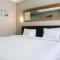 Minimalist Studio The Oasis Apartment near Omni Hospital Cikarang By Travelio