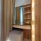 Fancy and Nice 1BR with Extra Room at Amartha View Apartment By Travelio - 三宝垄