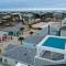 Pool Rooftop w Island Views Blocks to Beach Seas Your Dreams by AvantStay - Порт-Аранзас