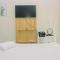 Comfort Studio at Green Pramuka City Apartment near Shopping Center By Travelio