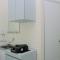 Comfort Studio at Green Pramuka City Apartment near Shopping Center By Travelio
