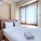 Cozy and Minimalist 2BR at Mutiara Bekasi Apartment By Travelio